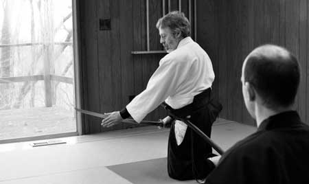 Paul Smith demonstrating for a student the unique Hōki-ryū technique of sōete-tsuki.